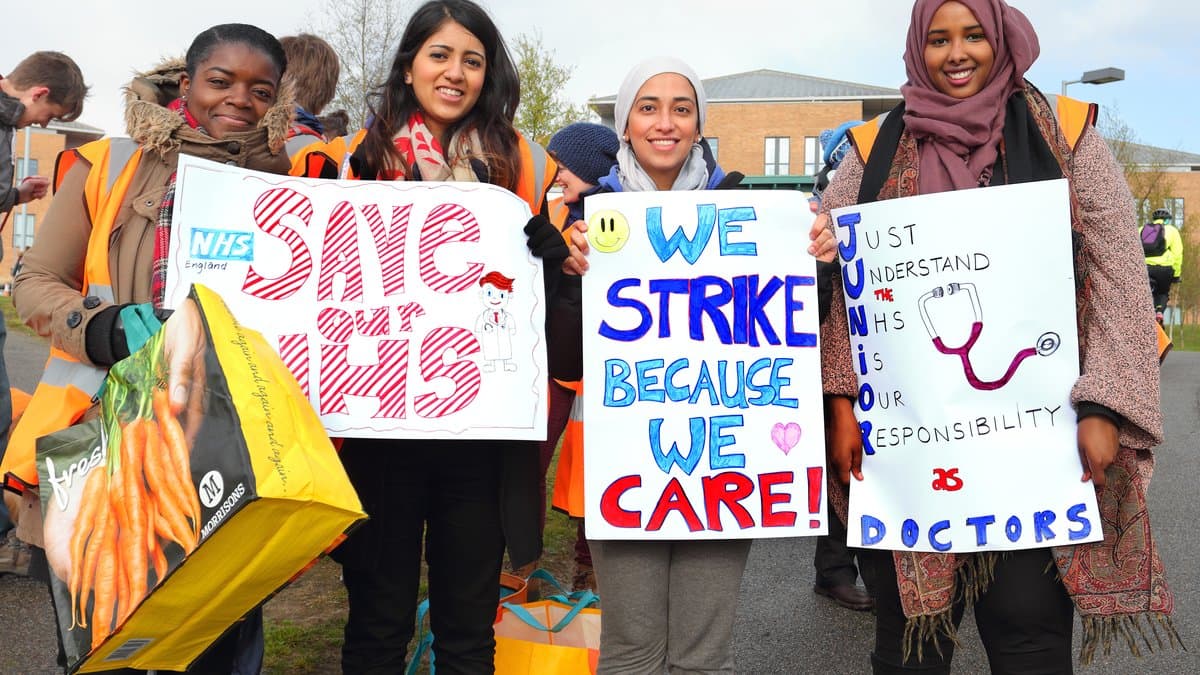 Junior doctors holding placards on the picket line outside Norfolk and Norwich University Hospital during the junior doctors strike